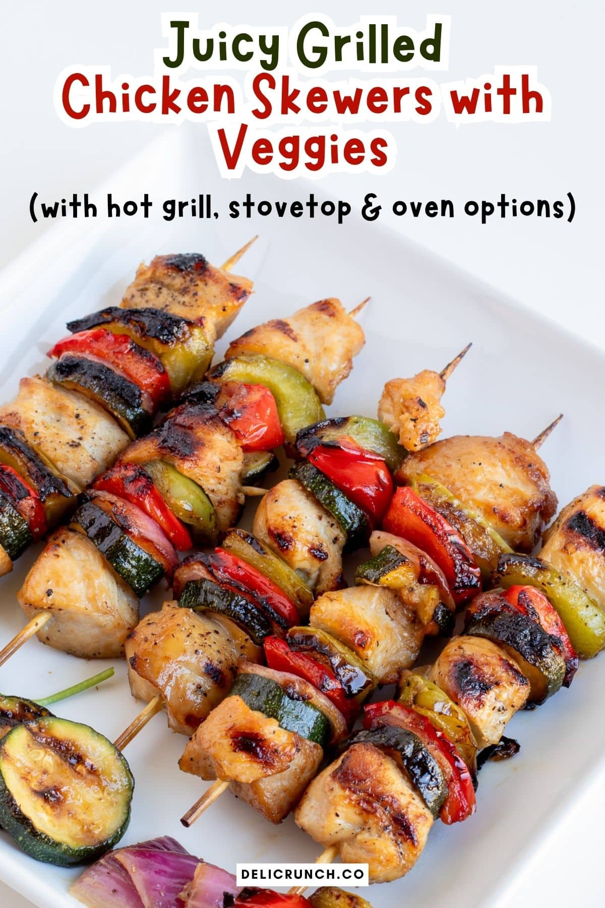 chicken kabobs with vegetables on a plate