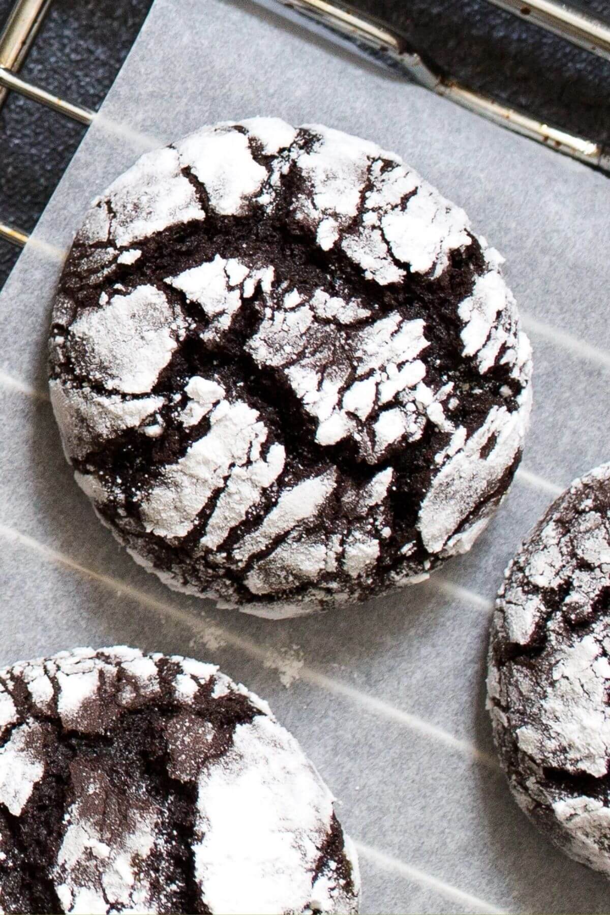 chocolate crinkle cookies on a cooling rack