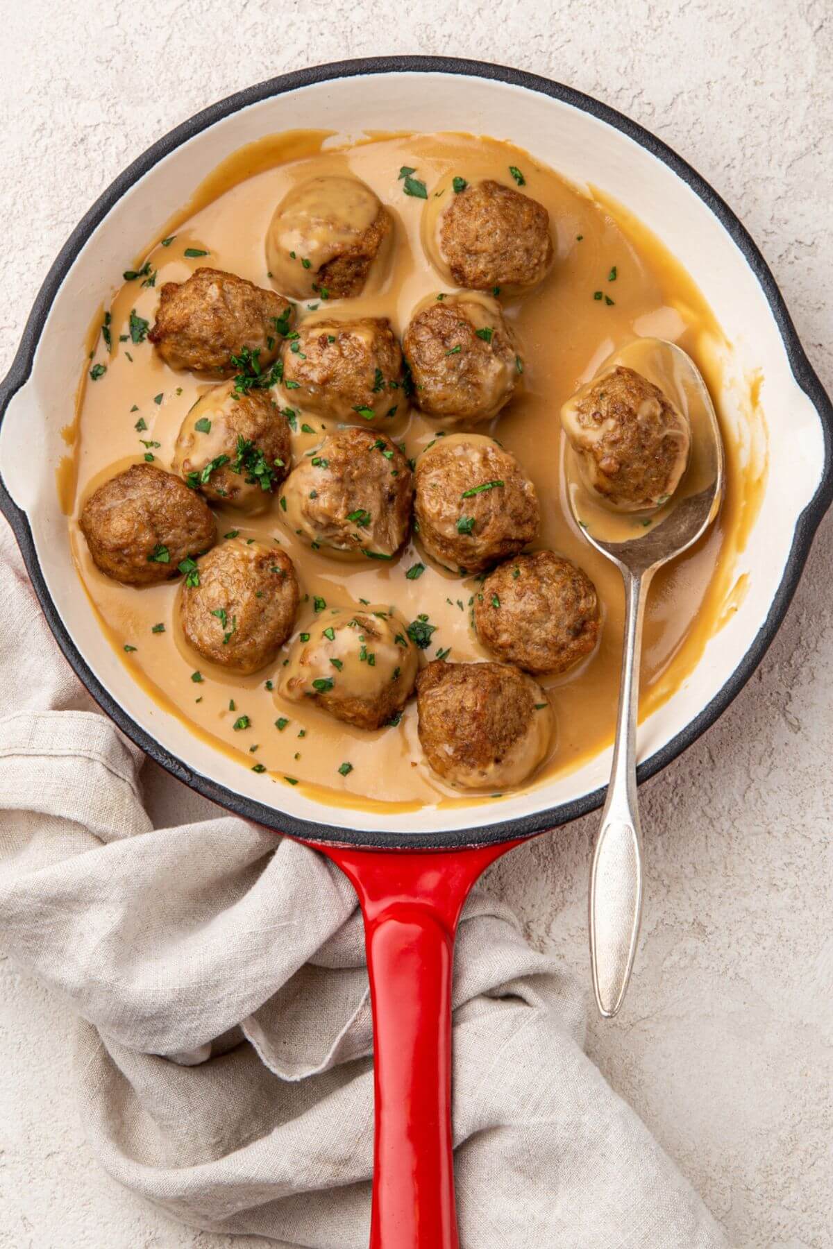 meatballs on a pan with gravy sauce