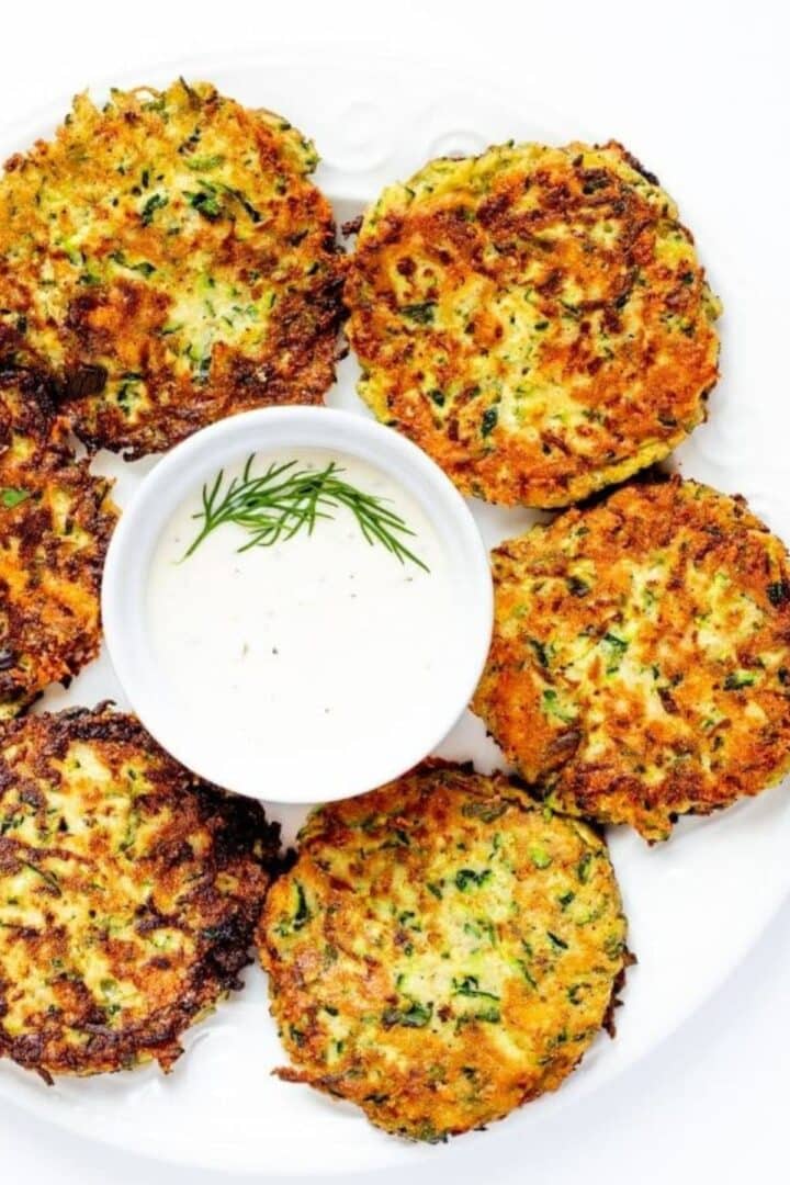 zucchini fritters on a plate with ranch dip