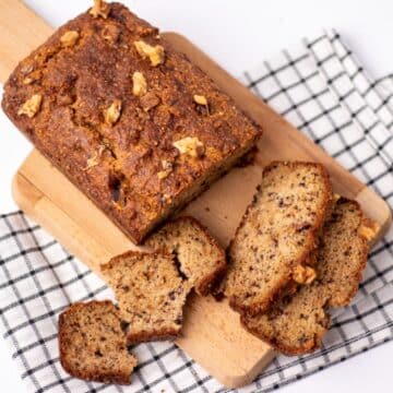 low carb banana bread load with slices on a chopping board