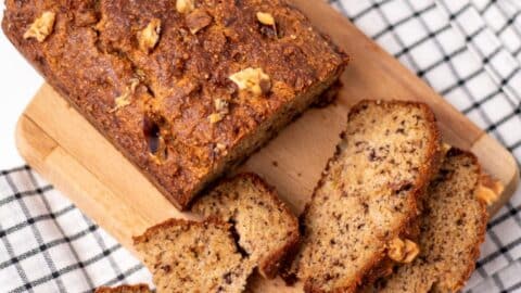 low carb banana bread load with slices on a chopping board