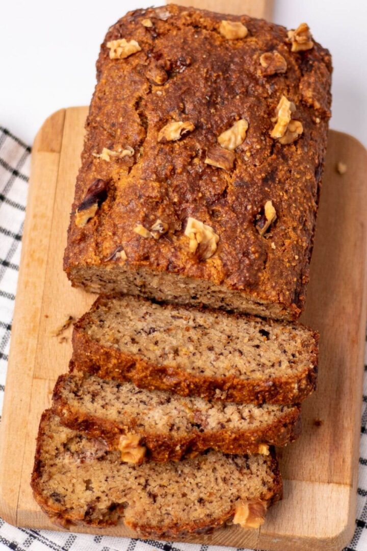 a loaf of low carb banana bread with slices. flat lay