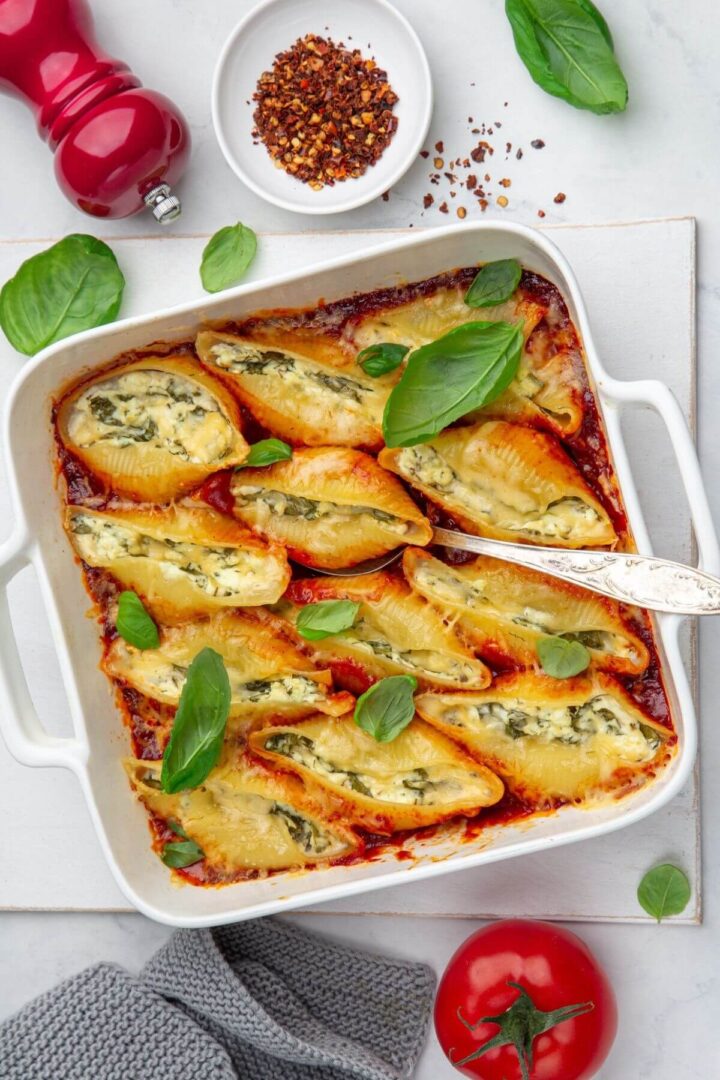 ricotta stuffed shells with spinach in a baking dish