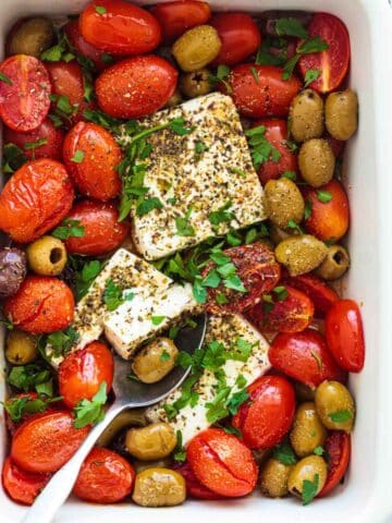 best tomato recipes - tomatoes and feta on a white baking dish