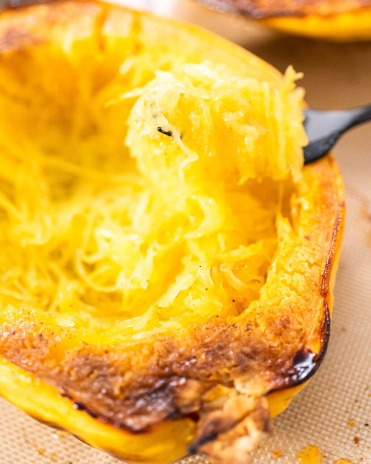 roasted spaghetti squash, halved with fork